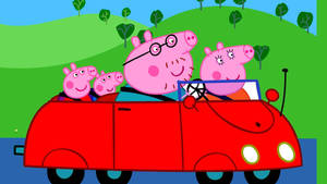 Peppa Pig 一家喺紅色車入面喺綠色山丘上