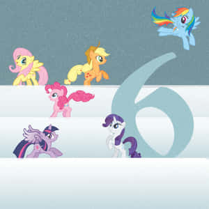 雪地場景中的六個My Little Pony角色和一個大數字六。 — iPad 第10代 壁紙