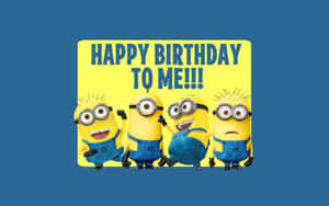 四個Minions用一個歡樂的標語牌慶祝生日。
