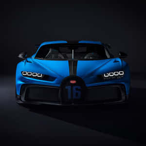 藍色Bugatti超級跑車，進氣格柵上有16號，在黑暗的攝影棚燈光下。