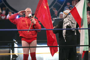 兩名摔角手在賽事期間於摔角擂台上向國旗敬禮。 — WWE GIF 壁紙