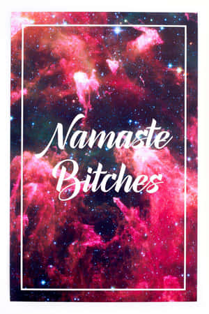 帶有粉紫色雲朵和星星的宇宙星雲，帶有白色草書文字「Namaste Bitches」。