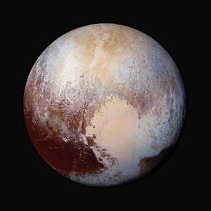 冥王星表面，有冰原和太空中略帶紅色的區域。 — 太空 壁紙