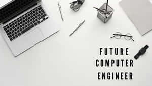 白色書桌，配有手提電腦、筆、眼鏡和智能手錶，文字 future computer engineer