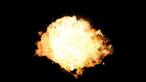 一場明亮的熾熱爆炸，橙色和黃色火焰在黑色背景上。