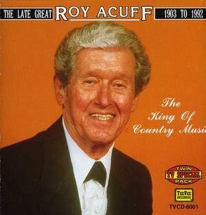 Roy Acuff 微笑的肖像，身穿黑色西裝，背景為橙色。 — 里維·阿卡曼 GIF 壁紙