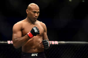 八角籠內的UFC拳手，穿著黑色手套和紅色手腕繃帶。 — 朗拿甸奴 壁紙