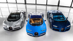 三輛Bugatti超級跑車在明亮簡約的攝影棚中展示，地板具有反光效果。
