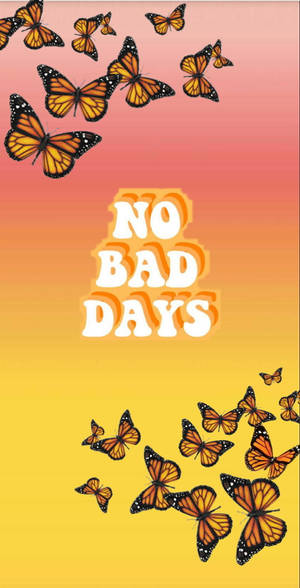蝴蝶在色彩繽紛的天空下圍繞著振奮人心的文字飛舞，文字寫著no bad days。 — 粉紅色蝴蝶 壁紙