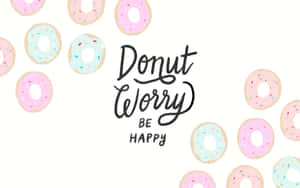 Donut worry be happy 勵志短語被帶有糖針的粉彩冬甩包圍。