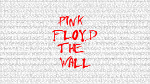 Pink Floyd The Wall 專輯封面，在褪色歌詞背景上有紅色文字。