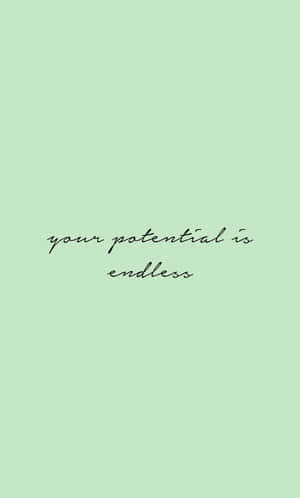 文字牆紙，在薄荷綠色背景上以黑色草書寫著 your potential is endless