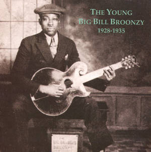 年輕的Big Bill Broonzy在復古棕褐色肖像中手持結他。