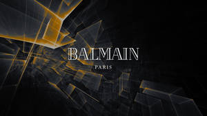 Balmain Paris 標誌，黑色背景上帶有發光的金色幾何碎片