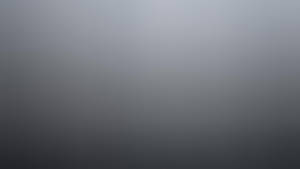 用於設計的平滑灰色到炭灰色漸變背景。