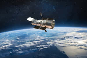 哈勃太空望遠鏡漂浮在地球上空，背景有星星。 — 太空 壁紙