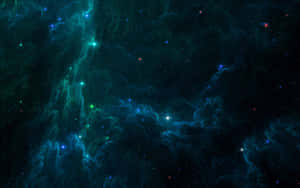 鮮豔的藍綠和靛藍星雲在深空中散佈的星星之間旋轉。 — 太空美學 GIF 壁紙