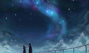 兩個剪影人物欣賞著帶有彩色星雲和雲彩的星空夜空。