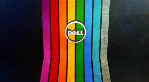 Dell 標誌居中喺彩色垂直條紋上，背景深色
