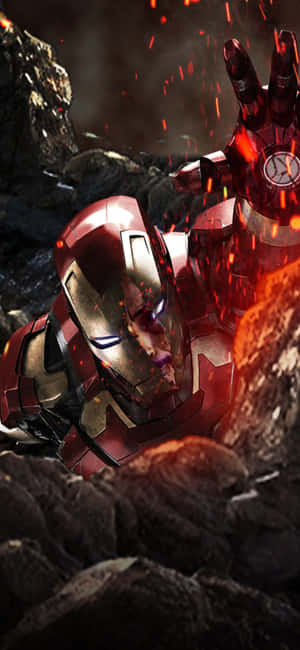 Iron Man 受損的戰衣被飛舞的火花和暗色岩石包圍。 — 復仇者聯盟標誌 壁紙