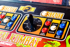 Mortal Kombat街機遊戲控制面板的特寫，帶有操縱桿和按鈕。 — 街機 壁紙