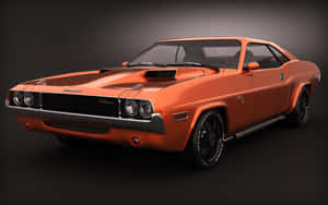 橙色經典 Dodge Challenger 肌肉車在工作室中，配備黑色輪圈和引擎蓋進氣口。