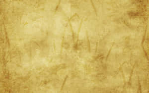 帶有有機圖案和斑駁色調的金色紋理背景。
