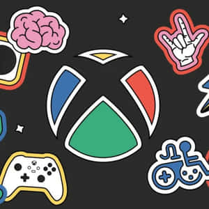 Xbox標誌被遊戲貼紙包圍，包括控制器和搖滾手勢。