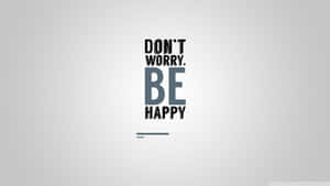 勵志語句「don't worry be happy」以粗體文字顯示在灰色背景上