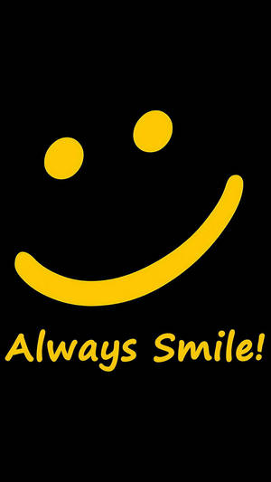一個黃色笑臉，上面有 Always Smile 字樣，背景為黑色。