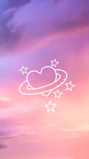 在粉彩天空中帶有光環和星星的心形行星。 — 天空景觀 壁紙