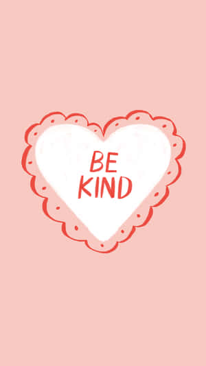 粉紅色背景上有一個白色心形，上面用紅色字母寫著 be kind。