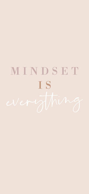 文字牆紙，以粉彩色粉紅色和白色字體寫著「mindset is everything」。