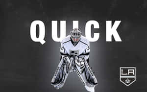 身穿 LA Kings 裝備的冰球守門員蹲伏準備，背後有 'QUICK' 文字。