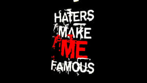 塗鴉文字，黑底紅白字寫著 'Haters Make Me Famous'。
