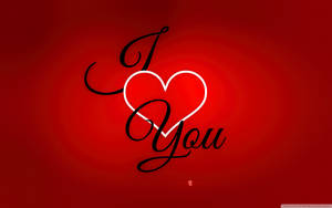紅色漸變背景上黑色草書的 I Love You 訊息及發光白色心形 — 16:10 壁紙