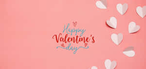 在粉紅色背景上帶有紙心的「Happy Valentine's Day」問候。