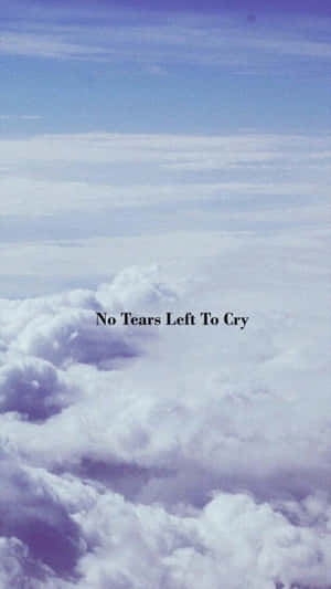 帶有雲朵和 'No Tears Left To Cry' 文字的平和天空