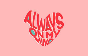 粉紅色背景上寫有「Always on my mind」的紅色心形文字。