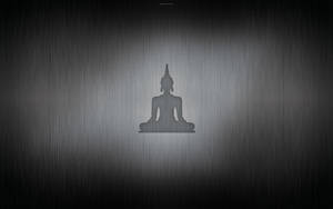 佛像剪影在拉絲金屬背景上，帶有漸變照明。