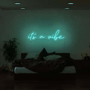 一張床上方有一個發光的青綠色霓虹燈牌，上面寫著「it's a vibe」的臥室。 — 氛圍 GIF 壁紙