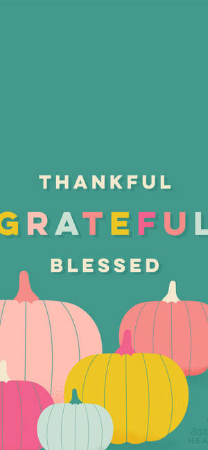 青綠色背景上帶有 thankful grateful blessed 文字的柔和色調南瓜