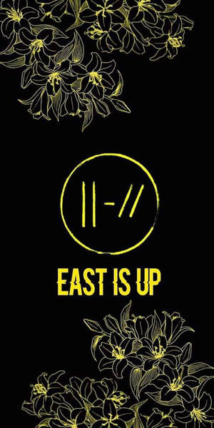 黑色背景上黃色花卉輪廓和文字，中間有「EAST IS UP」。