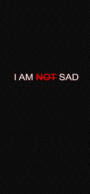 文字桌布，上面寫著「I AM NOT SAD」，紅色「NOT」在黑色背景上。