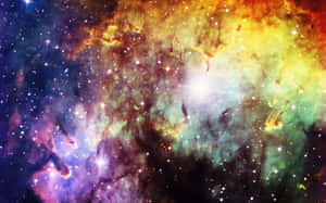一個色彩繽紛的星雲，充滿了發光的氣體雲和深空中的明亮恆星。 — 銀河 壁紙
