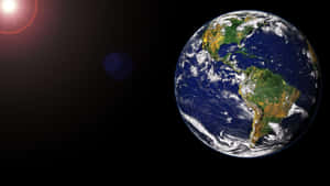 從太空看到的地球，帶有太陽耀斑和鏡頭散景效果。 — 行星 壁紙