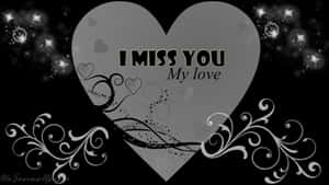 一個灰色心形，上面有文字 I miss you my love，周圍環繞著星星和漩渦。