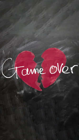 破碎的紅色心形，黑板上有game over文字。