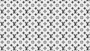 淺灰色背景上的黑白 Louis Vuitton 字母組合圖案。
