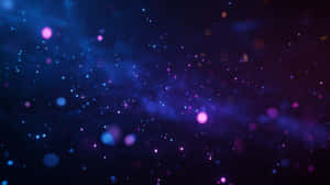 一個充滿活力的宇宙星雲，在深空中閃爍著藍色和紫色的星星。 — 太空 壁紙